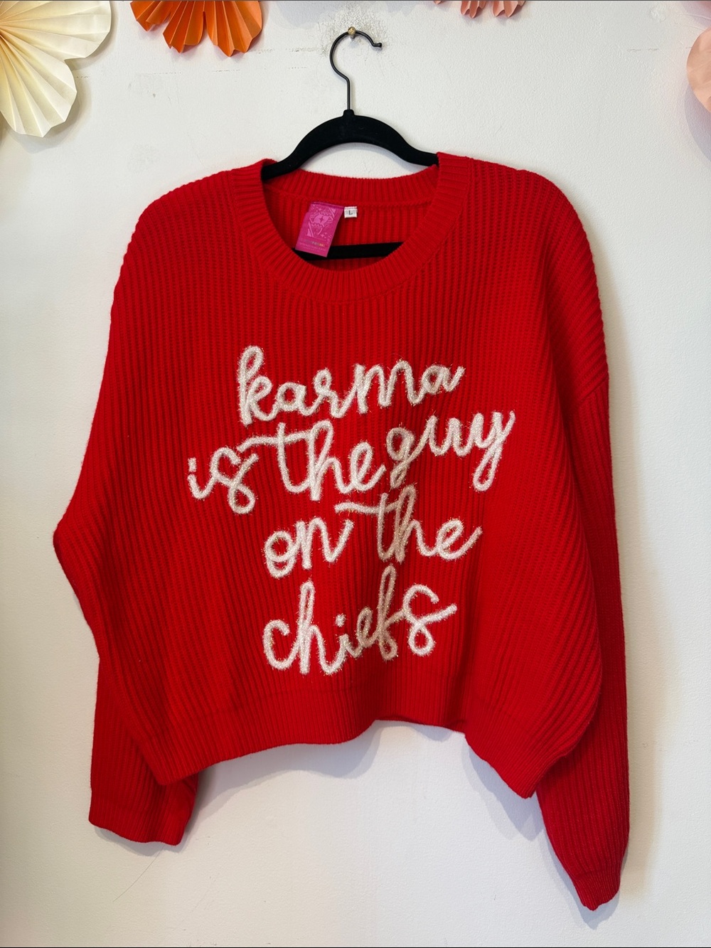 Queen of sparkles karma is the guy in the chiefs sweater large